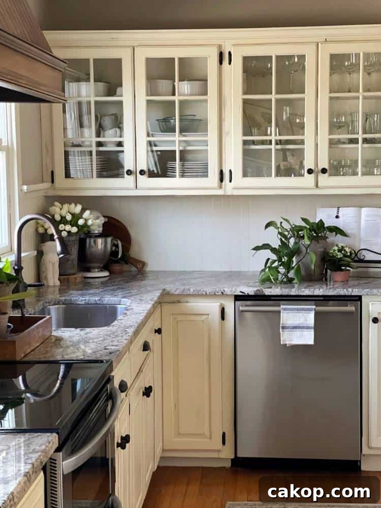 Stacy Ling blog kitchen with DIY painted cabinets with glass fronts