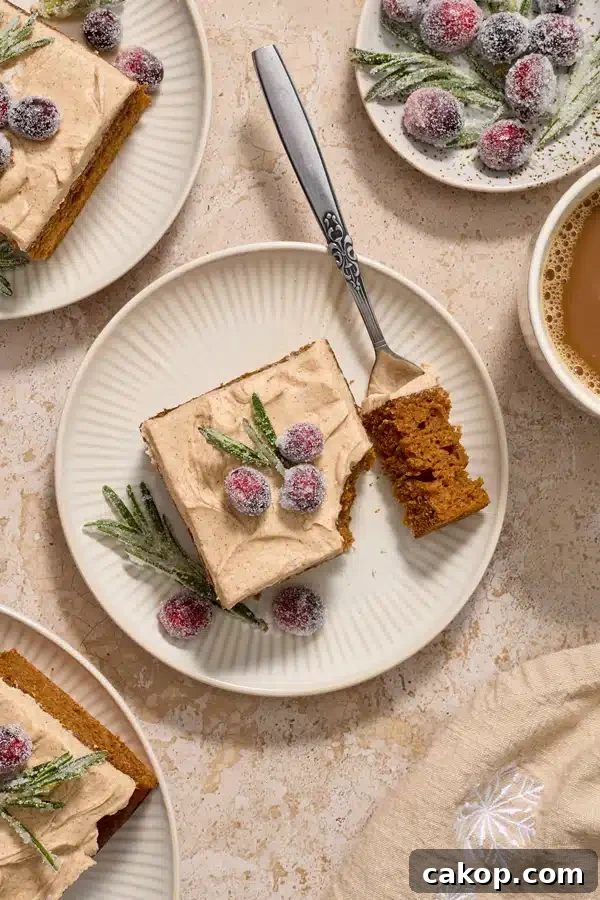 Slices of Dairy Free Ginger Cake on plates with coffee to the side.