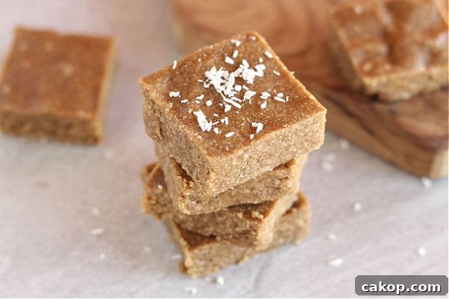 Stack of no-bake almond butter bars.
