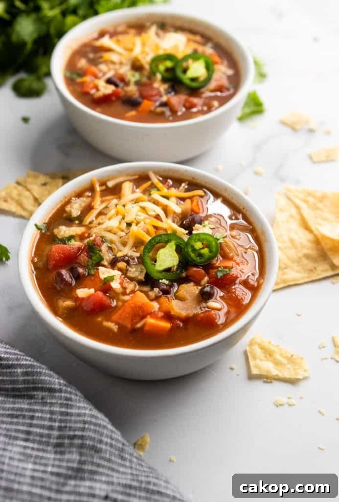 Hearty Black Bean and Rice Soup Recipe 2 Black Bean and Rice Soup with shredded cheese and jalapeno.