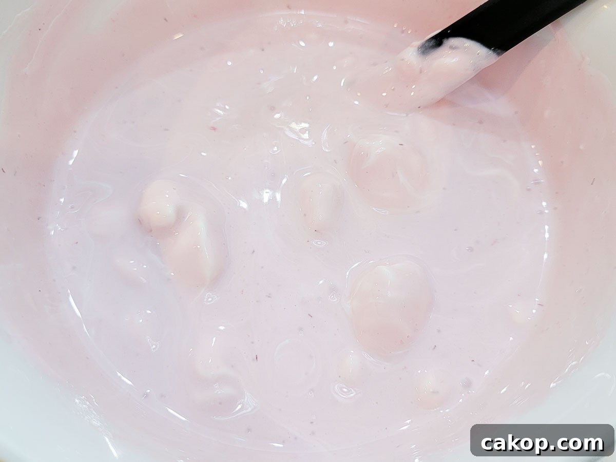 creamy strawberry mixture in a mixing bowl.