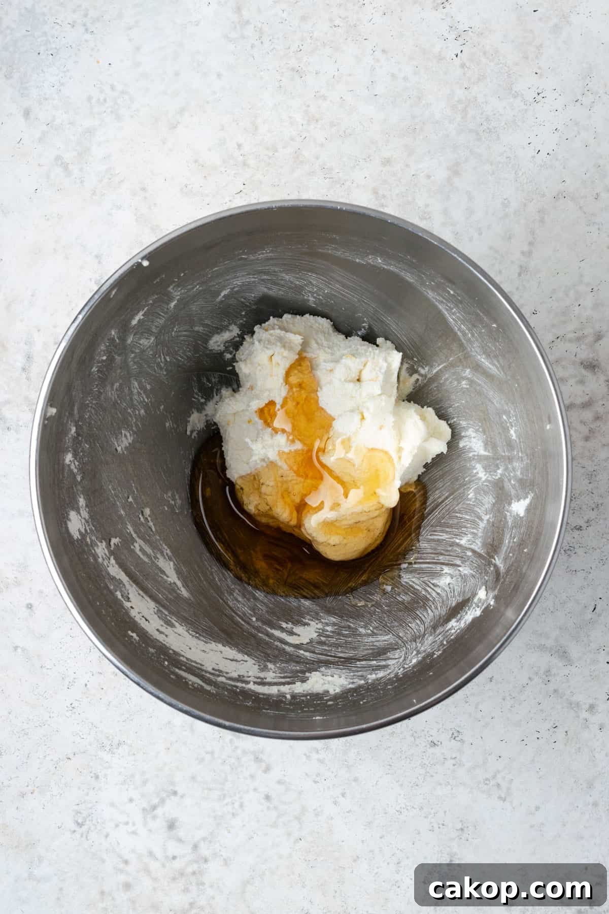 Honey poured over creamed butter and sugar.