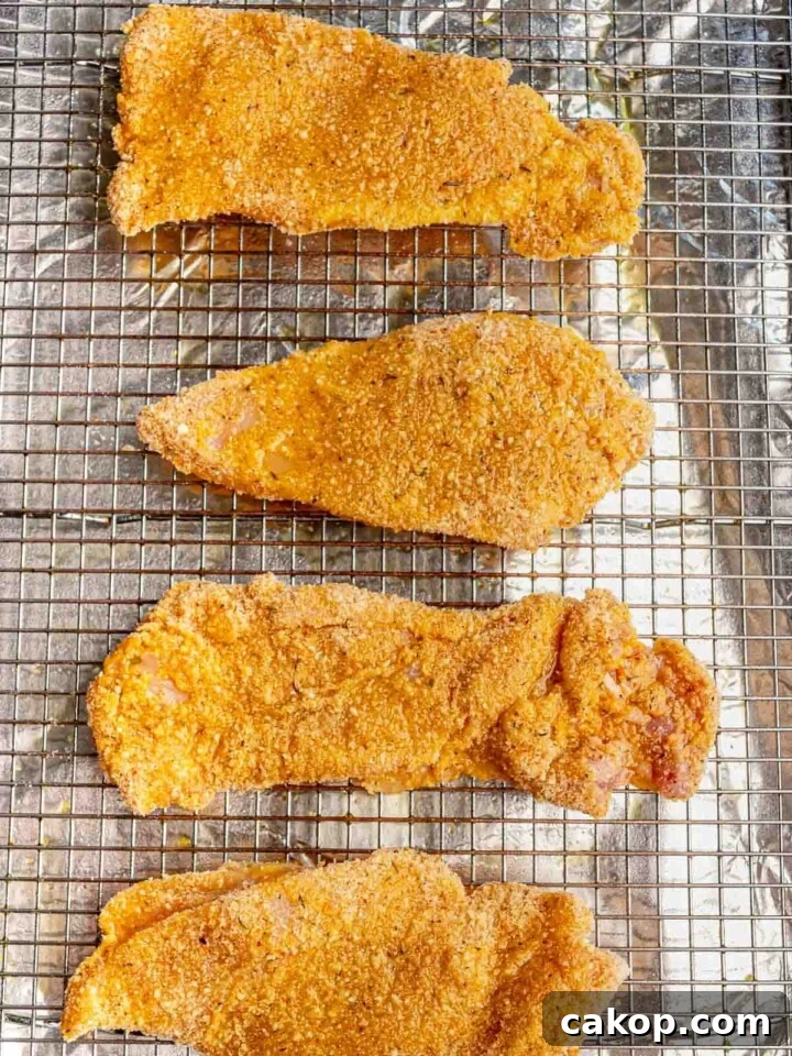 Breaded chicken on a pan.