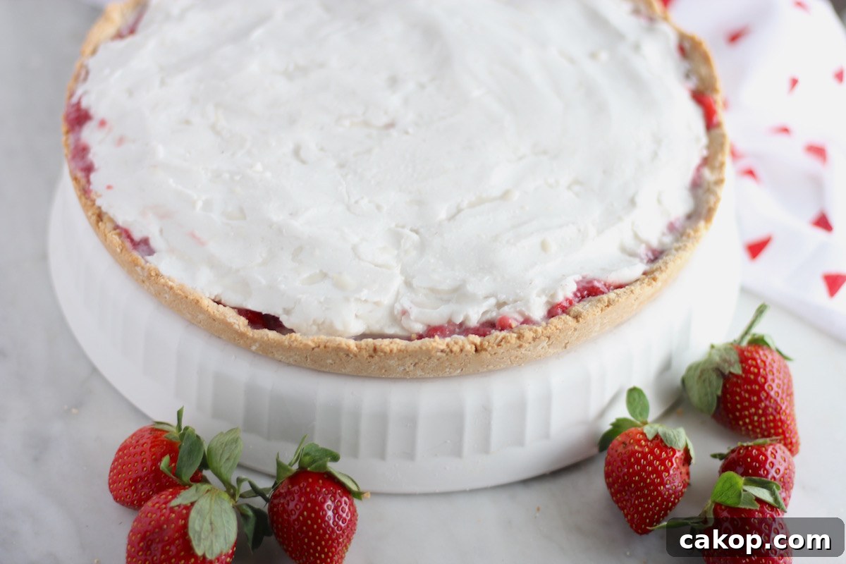 Paleo Strawberries and Cream Tart (AIP) - a decadent, yet healthy dessert for any special occasion! Fresh strawberries, coconut cream, and a crisp cookie crust make this tart to die for! | fedandfulfilled.com