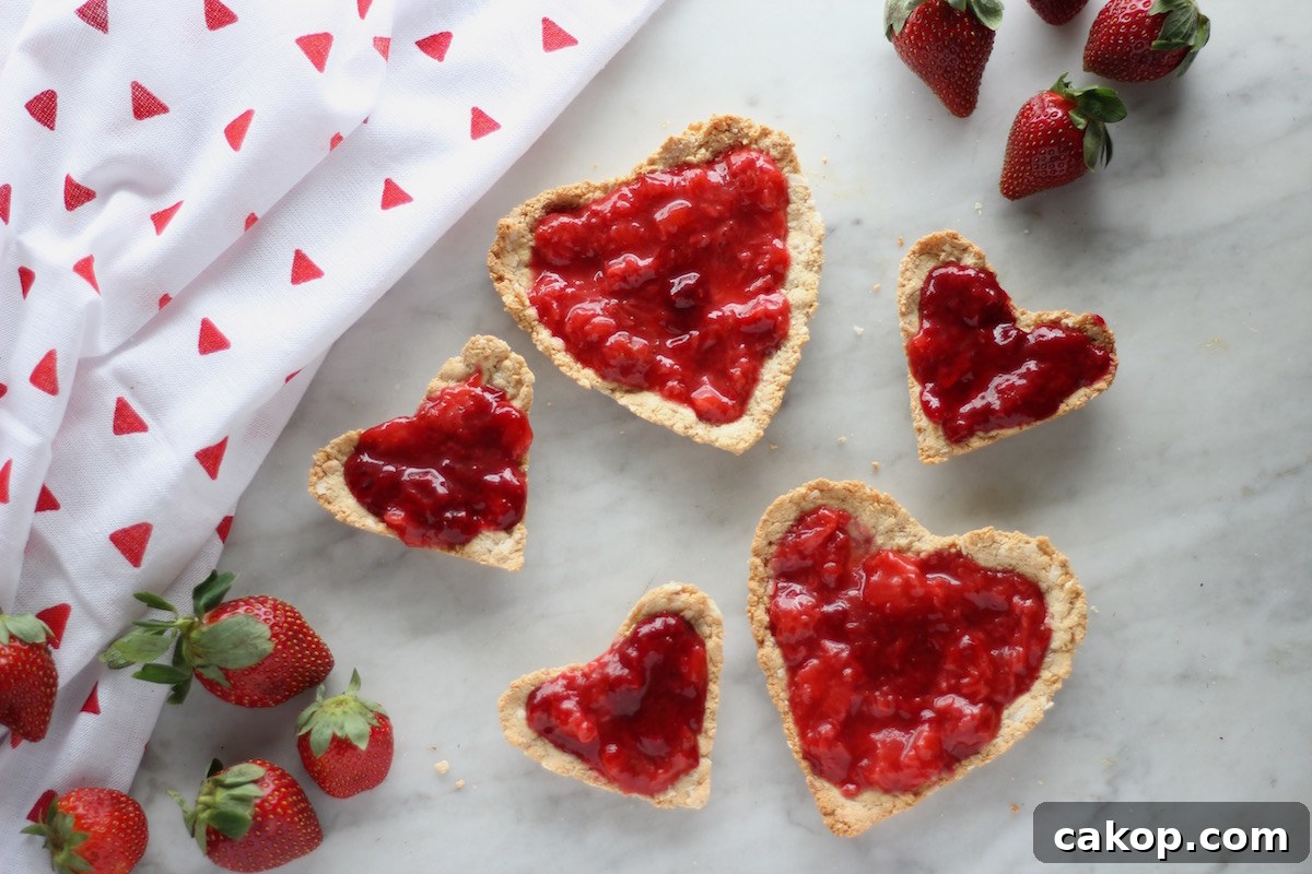 Paleo Strawberries and Cream Tart (AIP, Vegan) - a stunning dessert for a special occasion! Featuring fresh strawberry and coconut cream filling and an easy coconut cookie crust! | fedandfulfilled.com