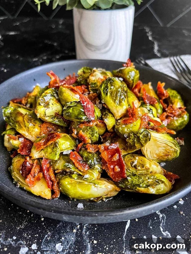 Roasted Brussels Sprouts with Bacon and Honey-Butter Glaze 15 A plate of roasted brussels sprouts with honey butter and bacon.