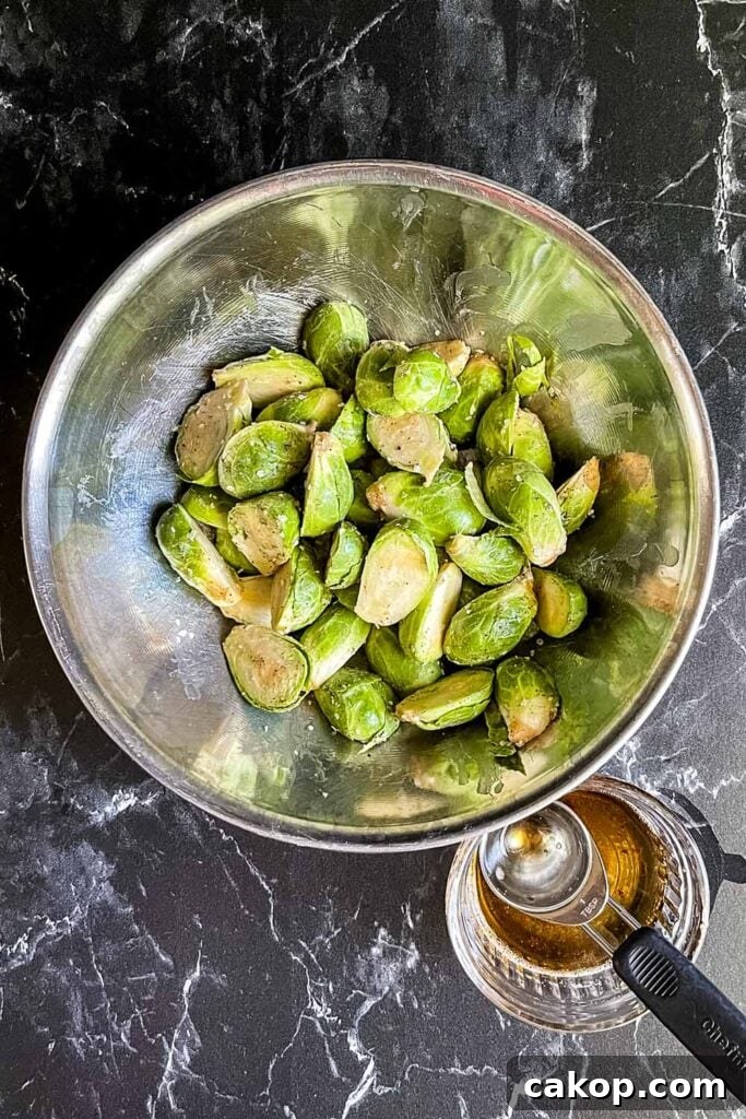 Roasted Brussels Sprouts with Bacon and Honey-Butter Glaze 4 Raw brussels sprouts covered with bacon grease, salt and pepper.