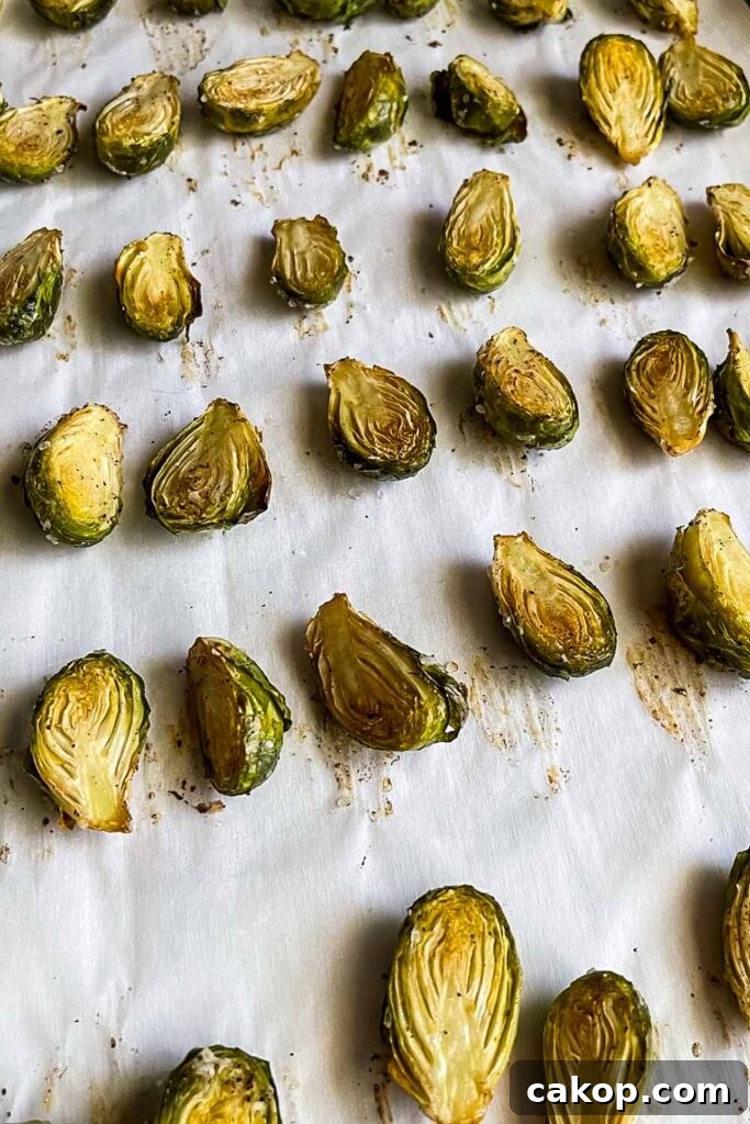 Roasted Brussels Sprouts with Bacon and Honey-Butter Glaze 7 Roasted brussels sprouts on baking tray.
