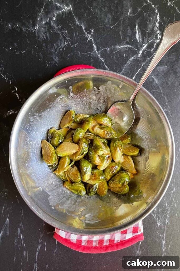 Roasted Brussels Sprouts with Bacon and Honey-Butter Glaze 8 Brussels sprouts in a bowl with butter honey.