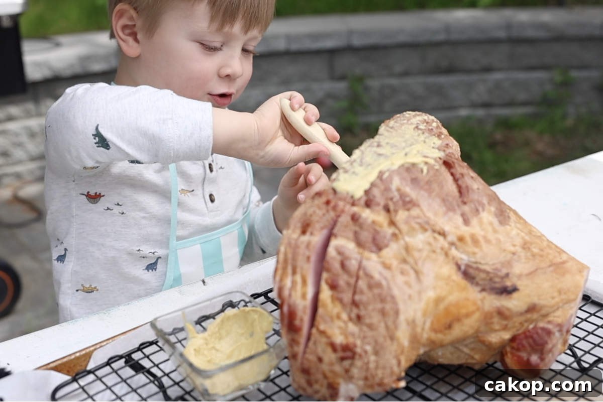 Double-Smoked Ham Recipe: How to Smoke Perfect Ham at Home 5 Brushing the ham with mustard.