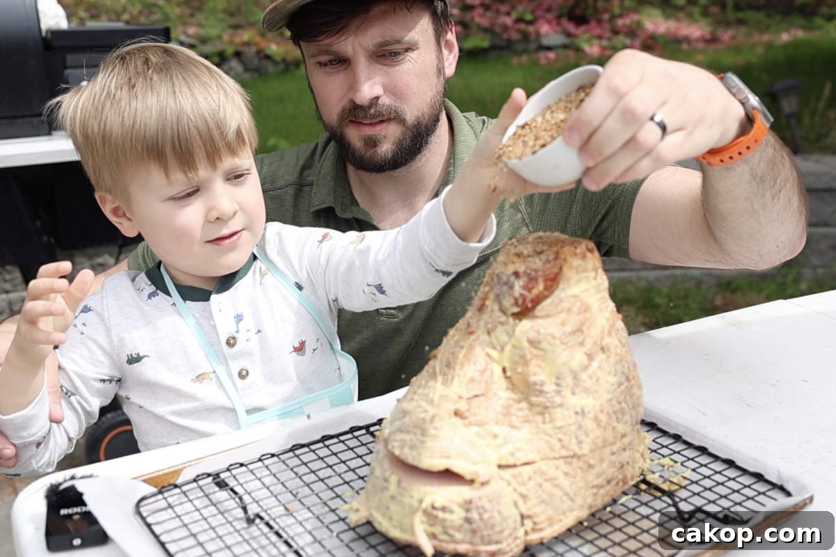 Double-Smoked Ham Recipe: How to Smoke Perfect Ham at Home 6 Seasoning the mustard coated spiral cut ham.