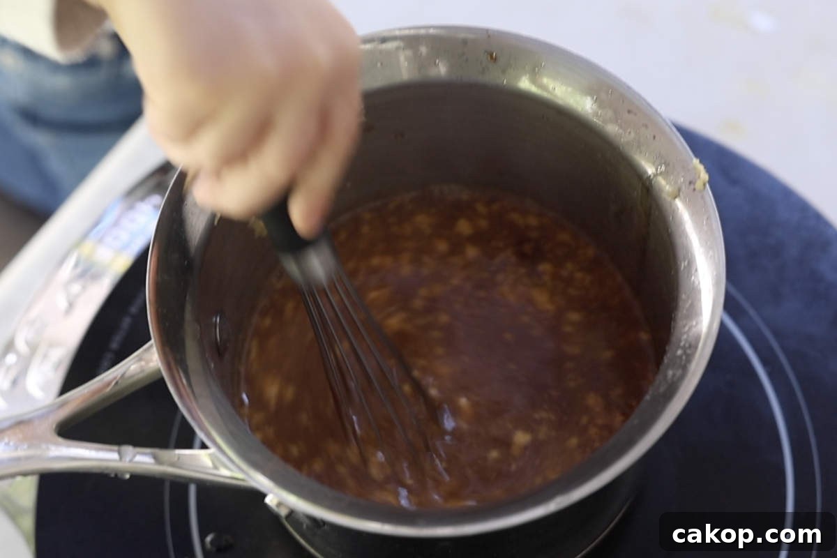 Double-Smoked Ham Recipe: How to Smoke Perfect Ham at Home 8 Simmering the glaze in a medium saucepan.