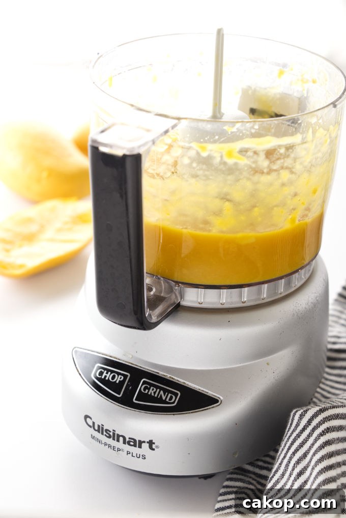 Coconut Mango Panna Cotta Recipe with Creamy Tropical Layered Dessert 3 Mango puree in a processor