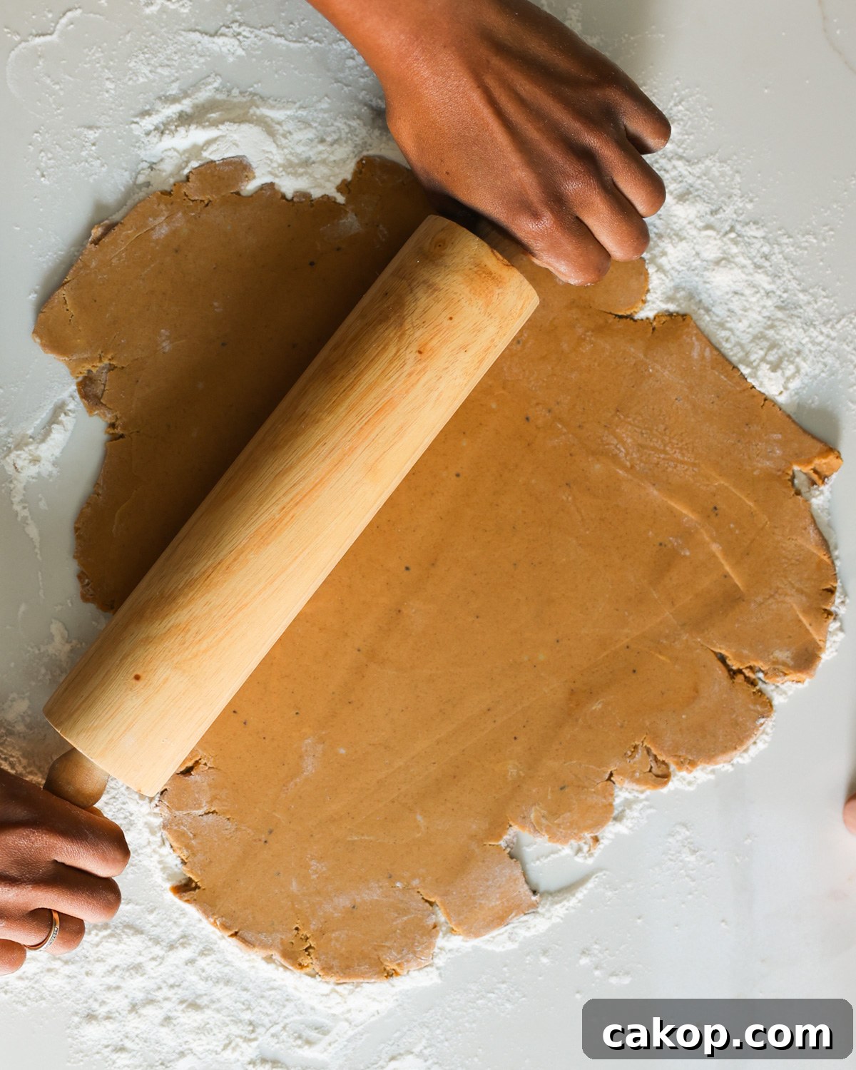 rolling out gingerbread cookie dough