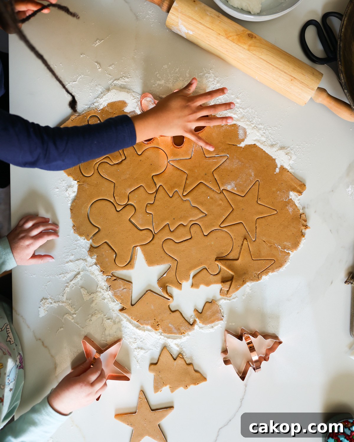 cutting gingerbread cookies