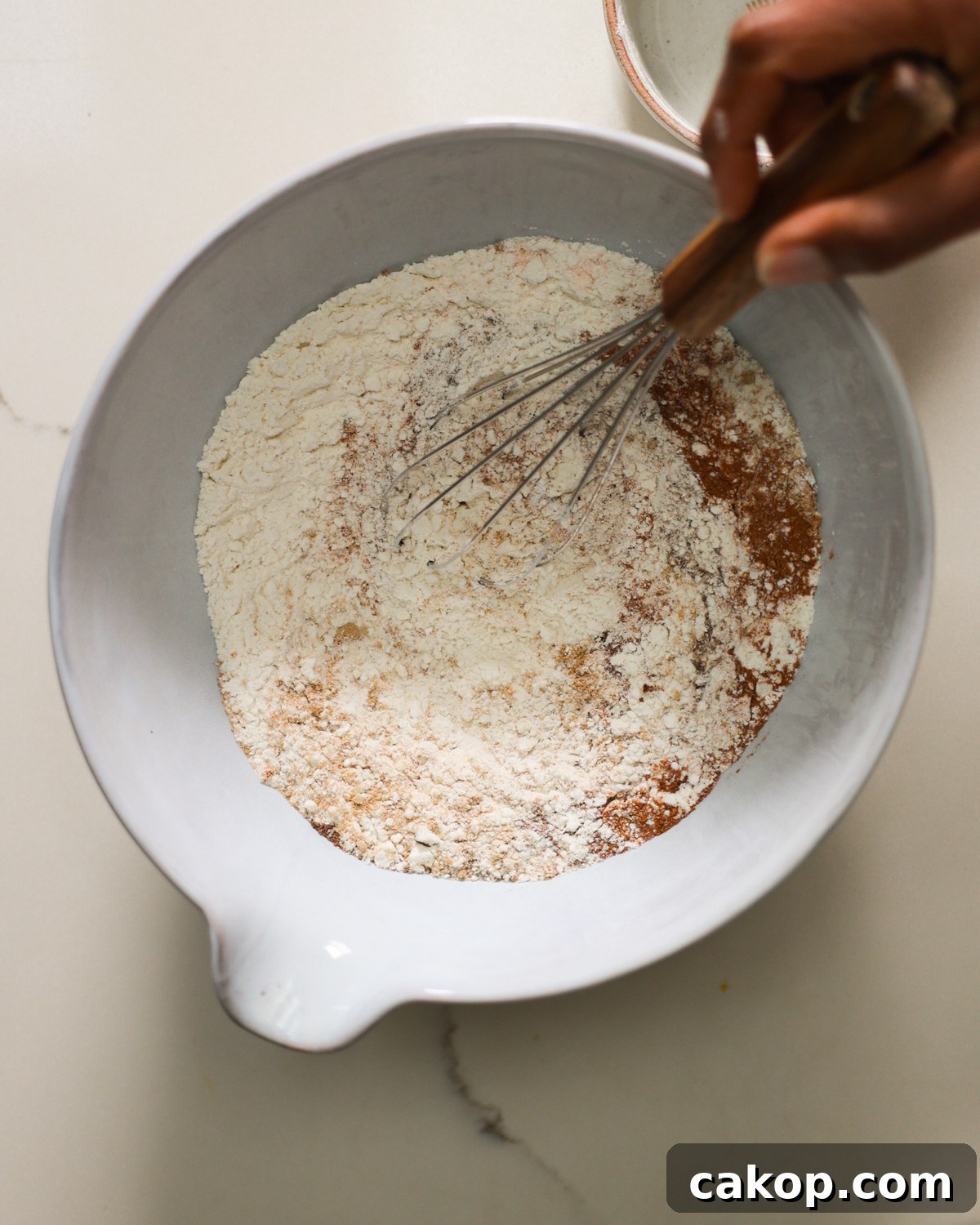 overhead mixing dry ingredients in bowl