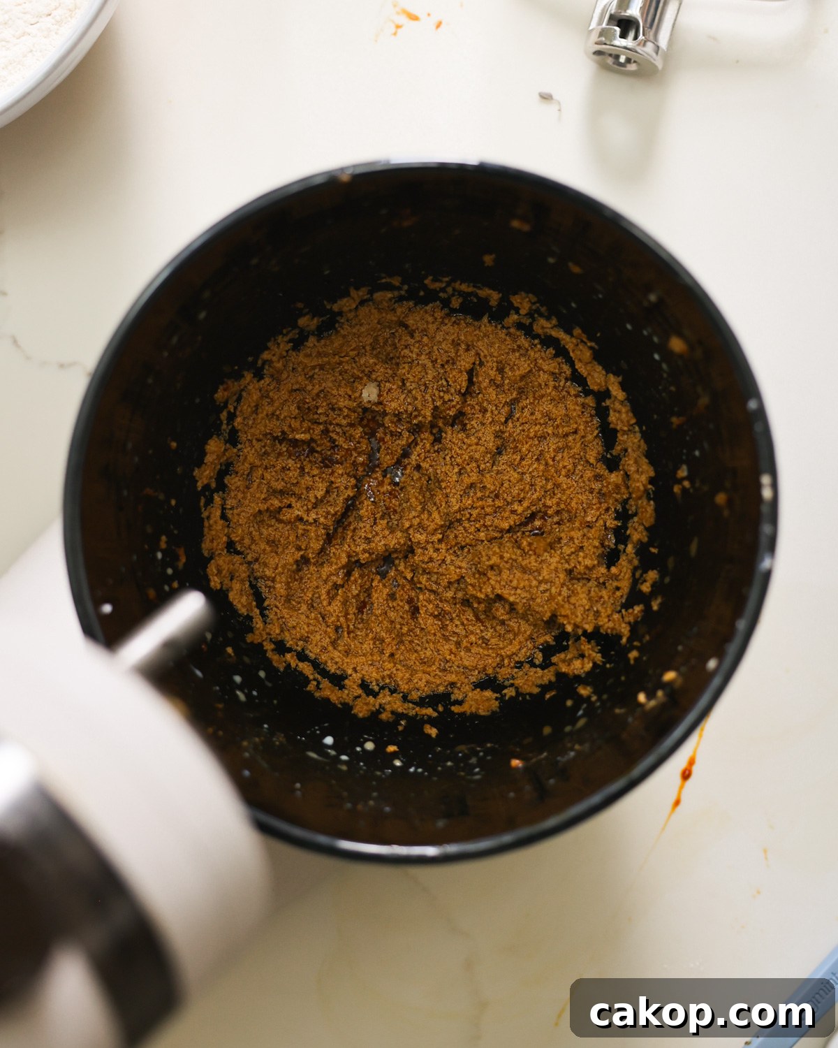 overhead coconut oil and sugar in mixer