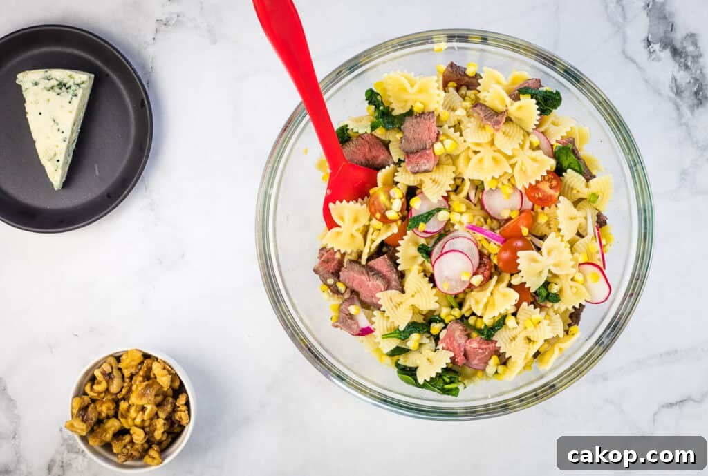 Toss the pasta and ingredients.