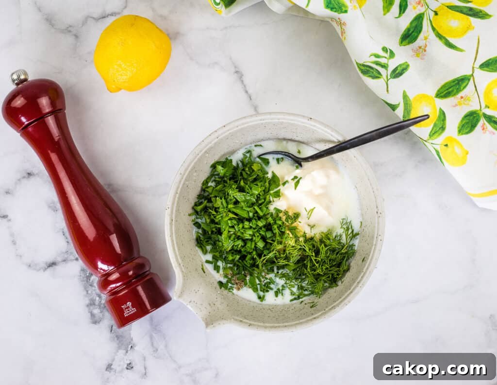Chopped herbs added to buttermilk and mayo.