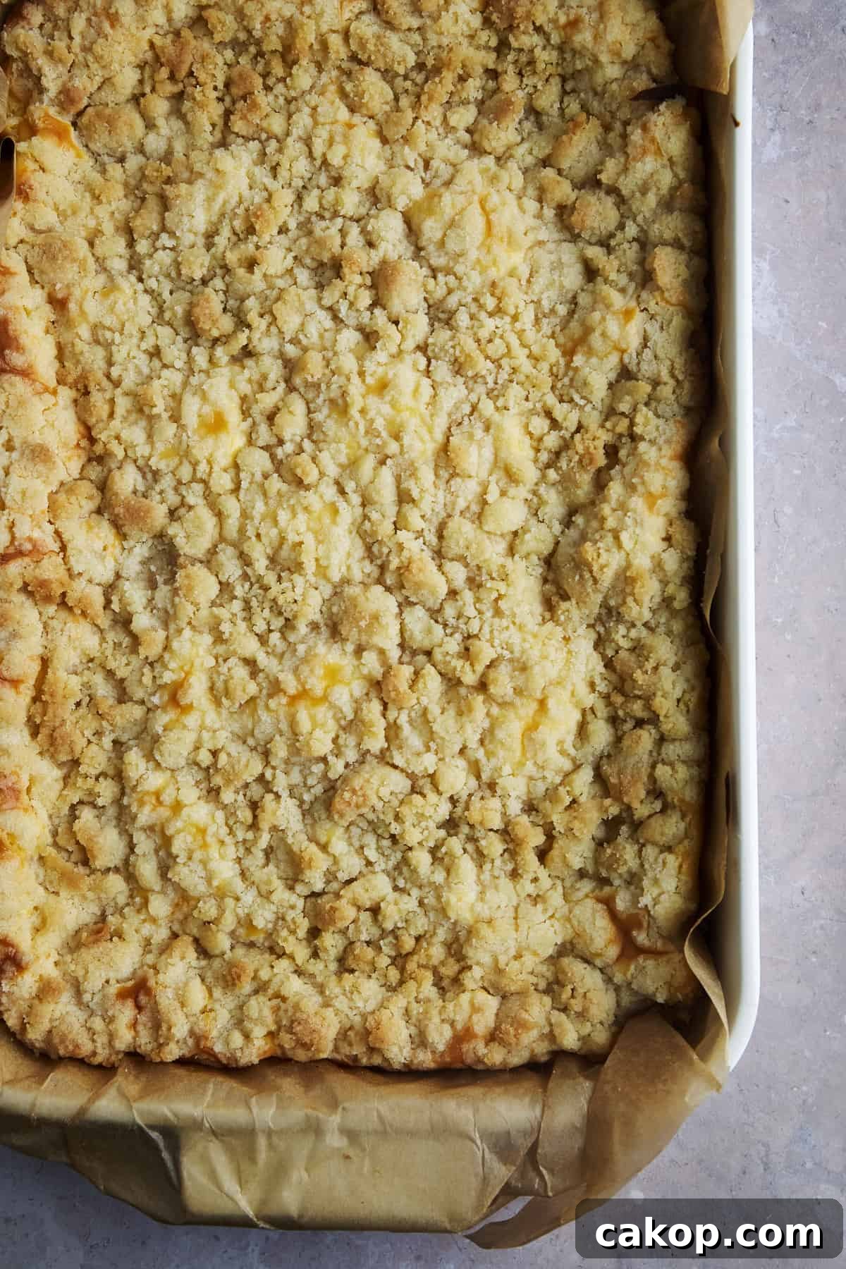 Lemon cheesecake bars chilling in pan