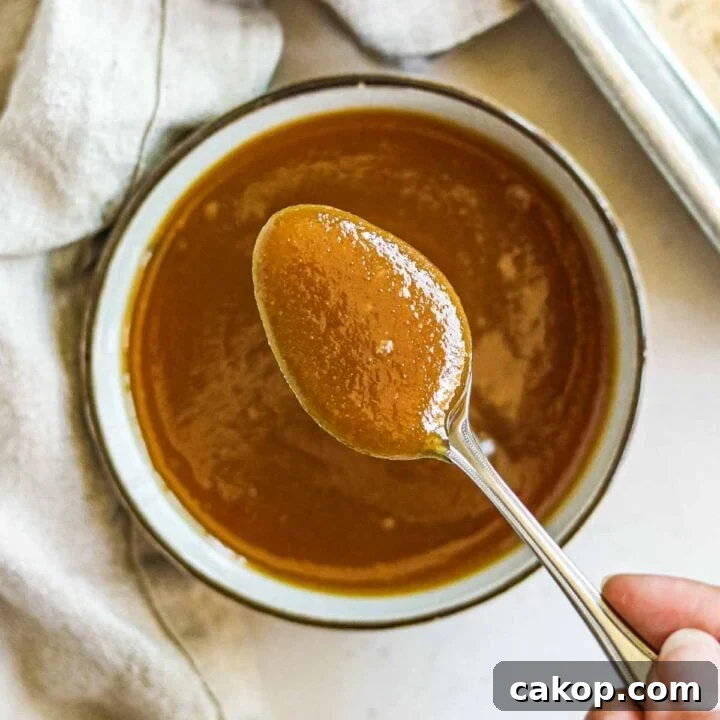 Creamy miso sauce (glaze and marinade) in a bowl with a spoon, for vegetables, fish, chicken, and more.