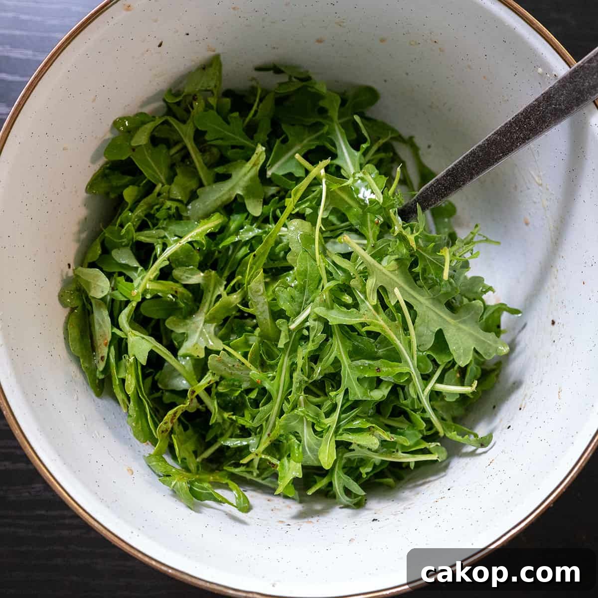 Reverse-Sear Smoked and Grilled Burgers for Juicy Results 11 bowl of dressed arugula.