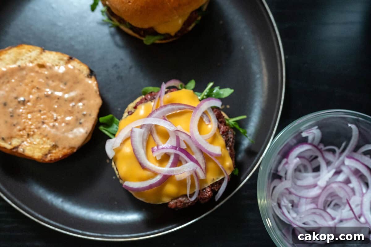 Reverse-Sear Smoked and Grilled Burgers for Juicy Results 14 Onions on burger.