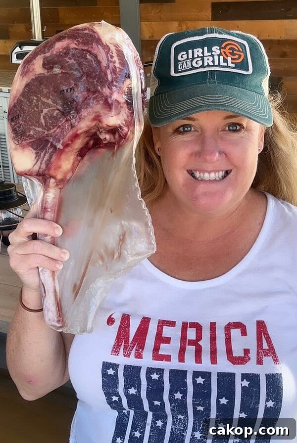 Reverse-Sear Smoked and Grilled Burgers for Juicy Results 19 Christie Vanover holding a raw steak.