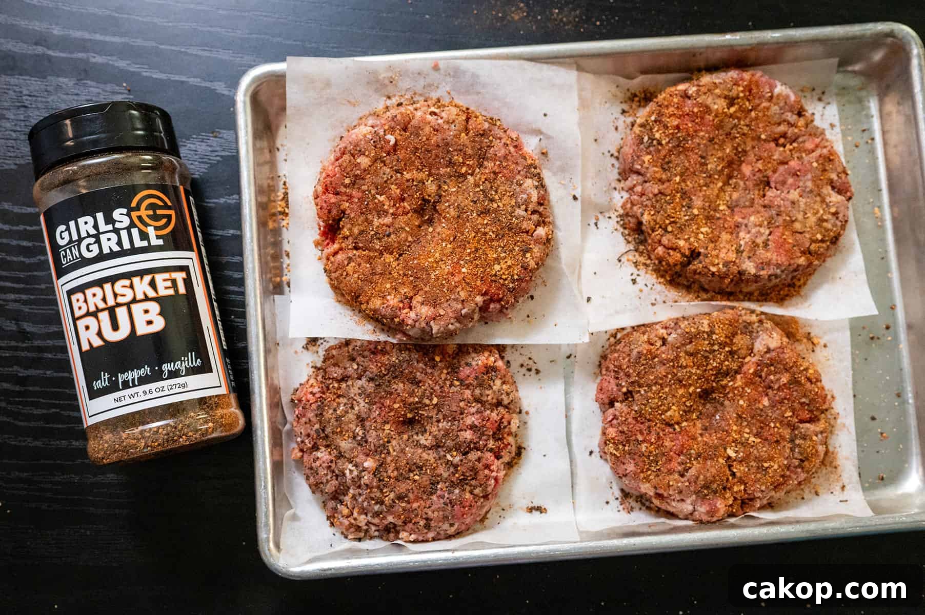 Reverse-Sear Smoked and Grilled Burgers for Juicy Results 6 Burger patties seasoned with Girls Can Grill brisket rub.