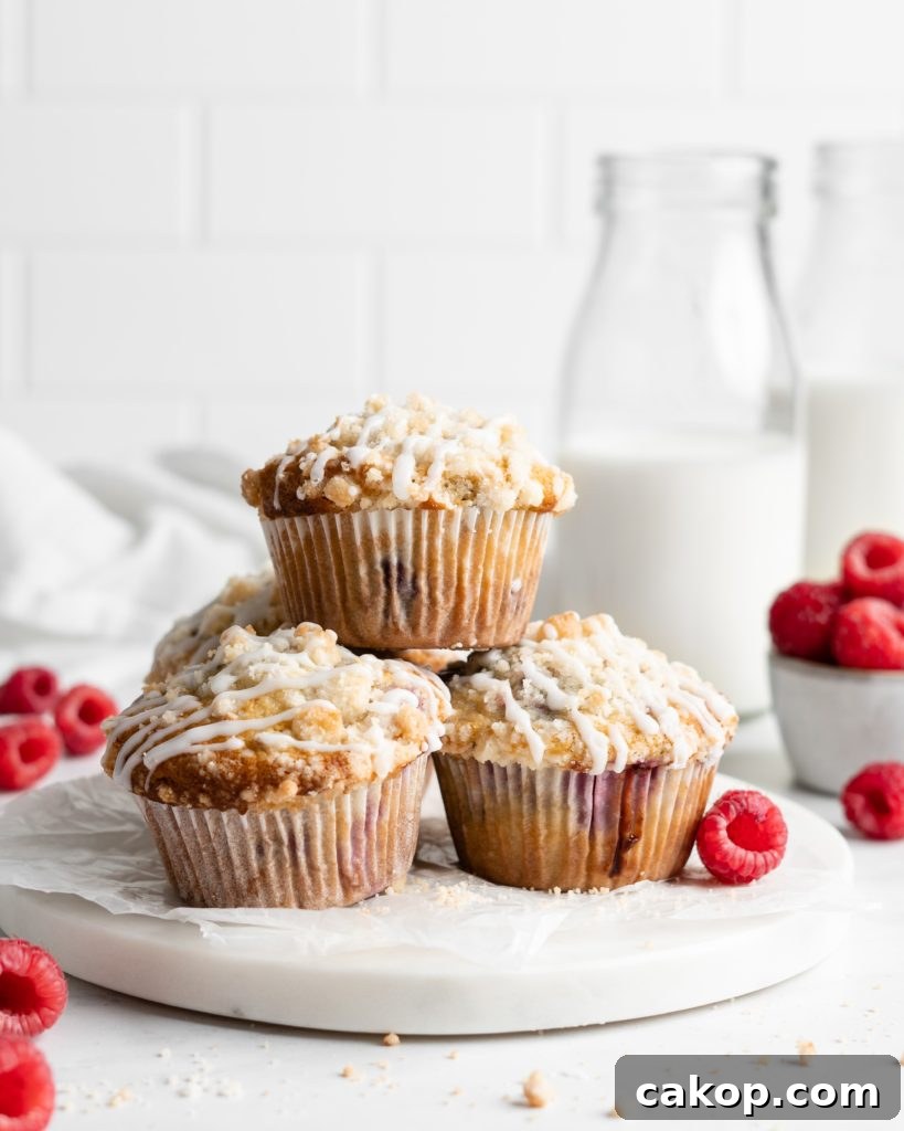 Fluffy and tall Buttermilk Raspberry Muffins with streusel topping