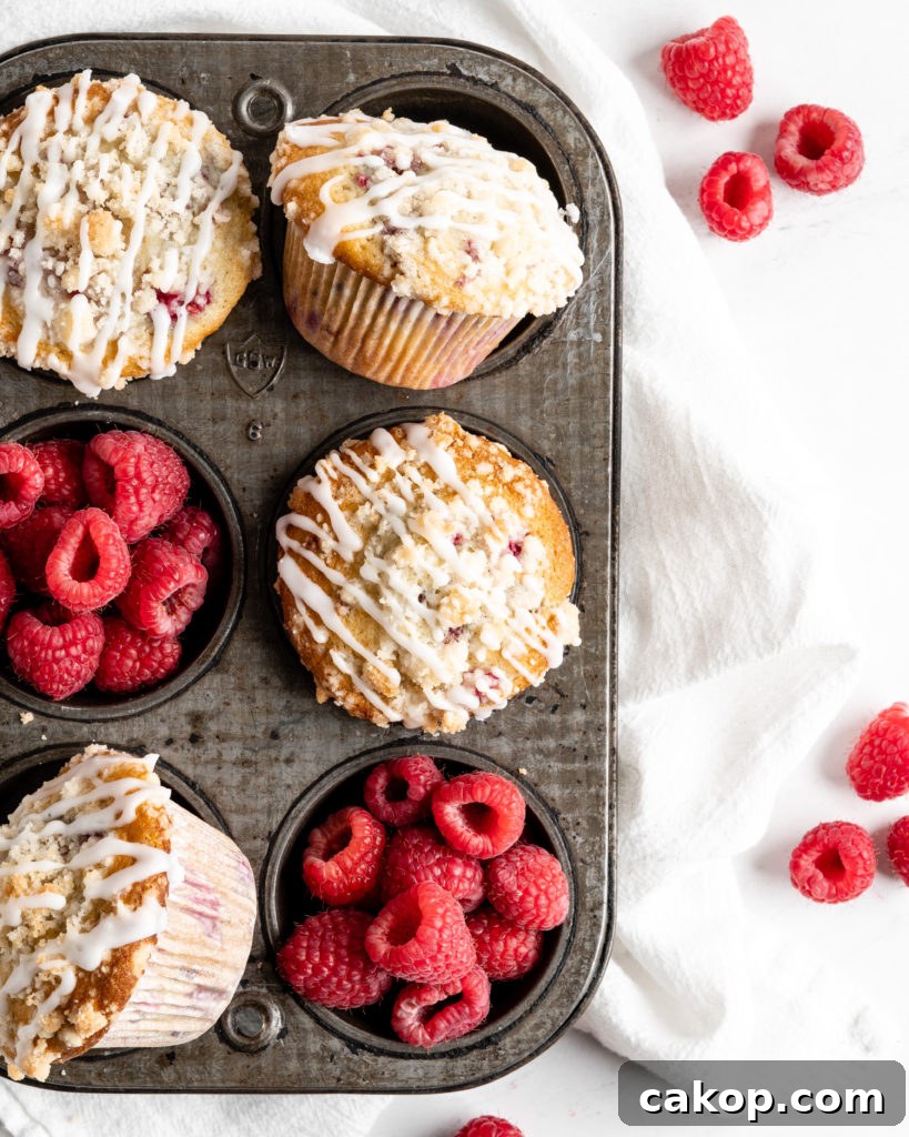 Fluffy and tall Buttermilk Raspberry Muffins with streusel topping