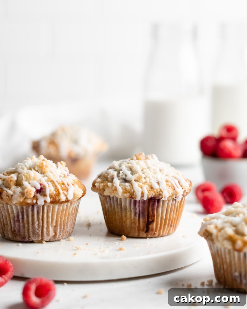 Fluffy and tall Buttermilk Raspberry Muffins with streusel topping