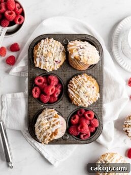 Fluffy and tall Buttermilk Raspberry Muffins with streusel topping