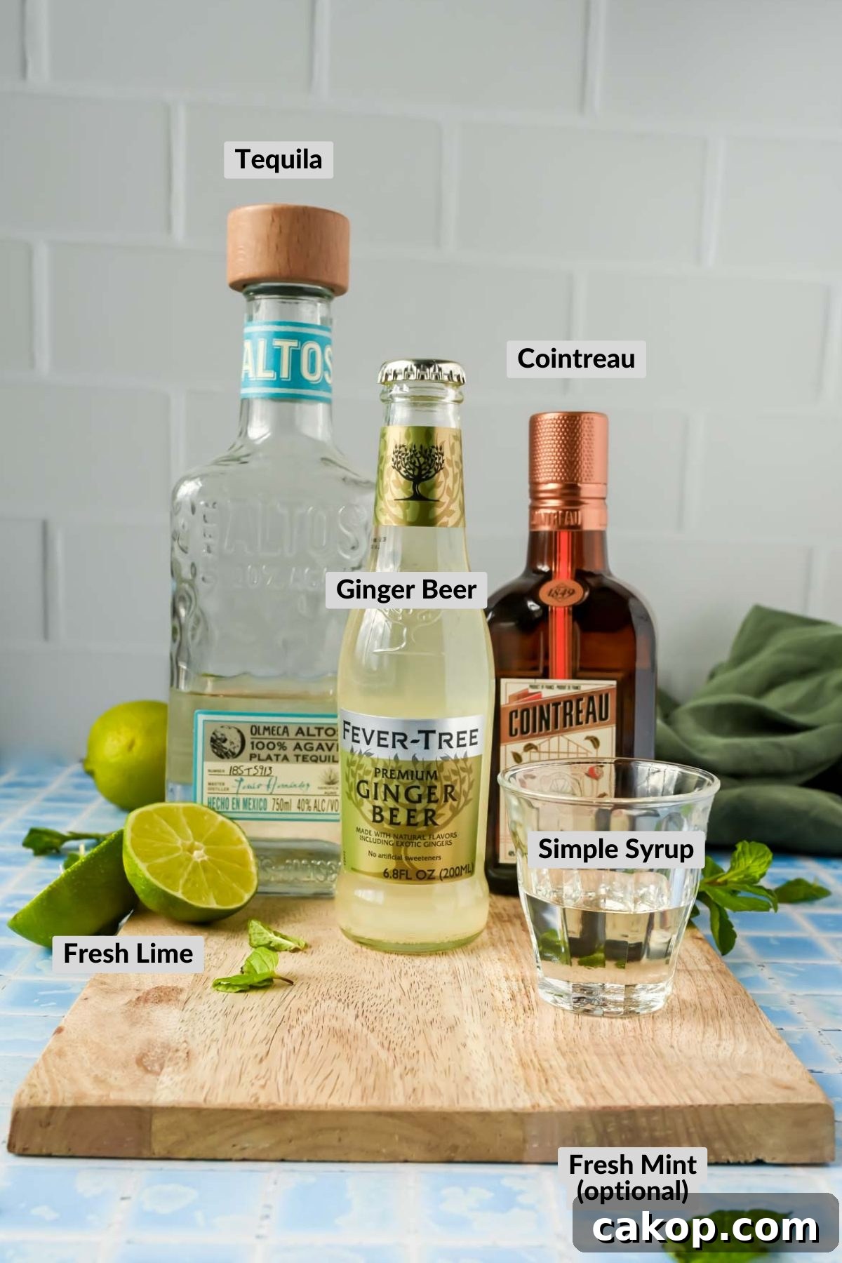 ingredients for tequila mule on a board.
