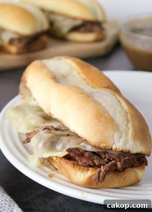 Easy French Dip Sandwiches {Crockpot or Instant Pot Recipe} with a side of au jus gravy sauce