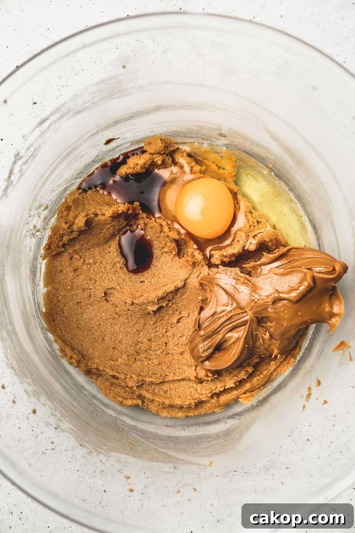 Biscoff Cookie Butter Cookies Recipe — Crunchy Spiced Biscuits 6 mixing wet ingredients for cookie butter cookie dough