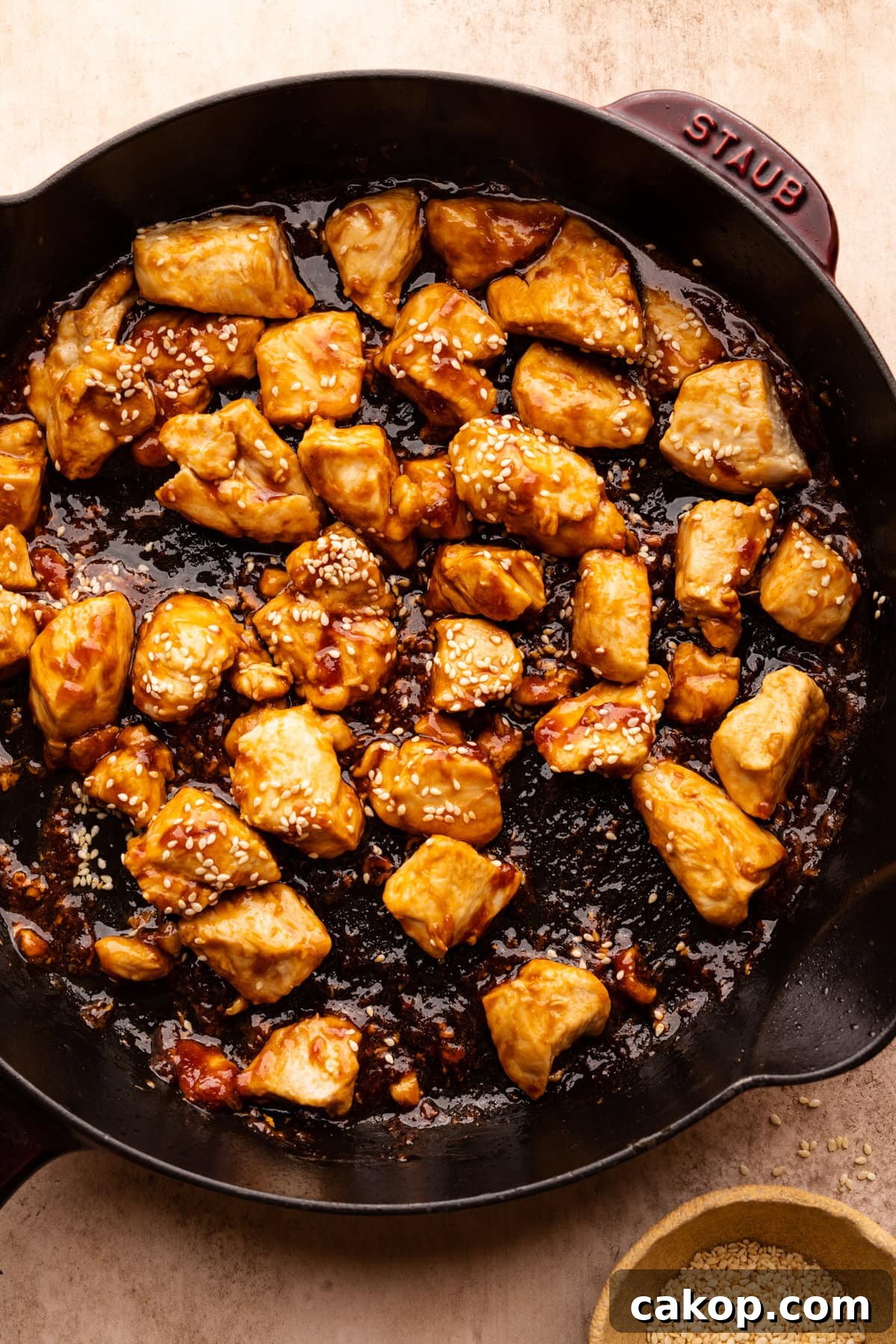 Quick Teriyaki Chicken Stir-Fry Ready in 10 Minutes 6 A black skillet pan with teriyaki chicken stir fry in it.