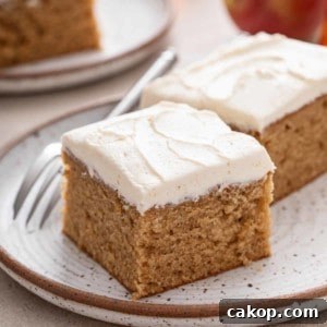 Two slices of apple butter cake on a stoneware plate.