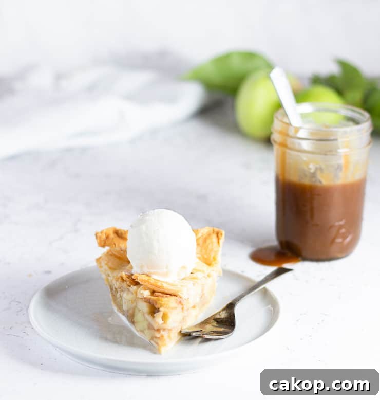 slice of apple pie in front of jar of butterscotch
