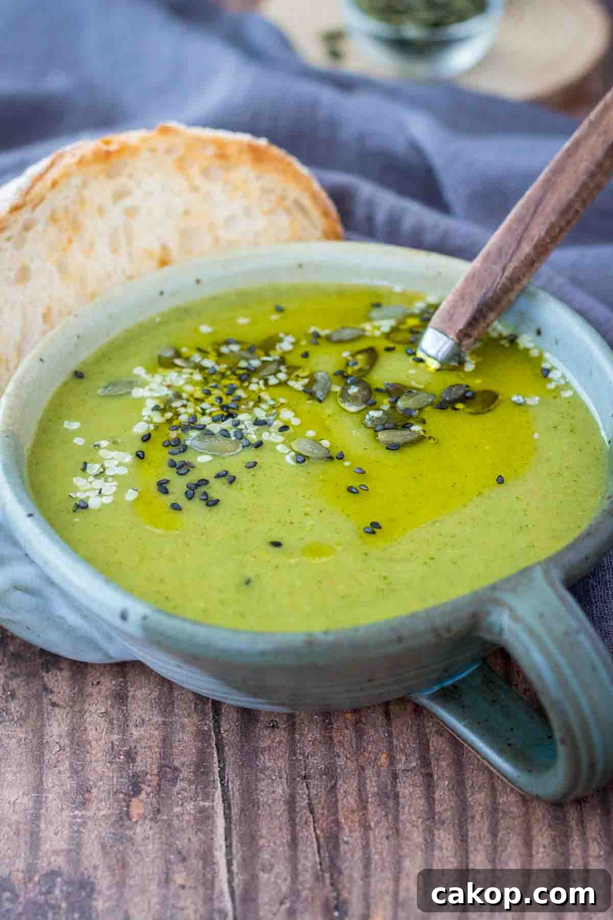 Fiery Roasted Broccoli Soup with Garlic and Chili Oil 4 Creamy Spicy Broccoli Soup served in a bowl topped with pumpkin seeds