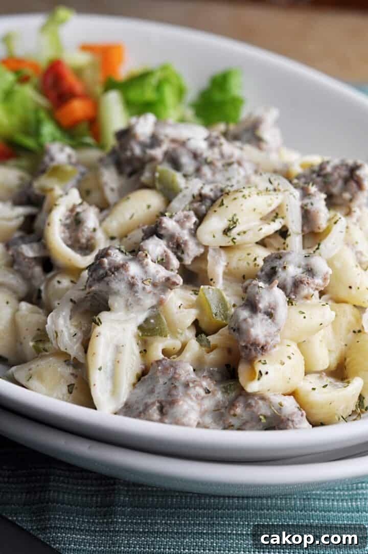 Ground beef cheese and shells with salad