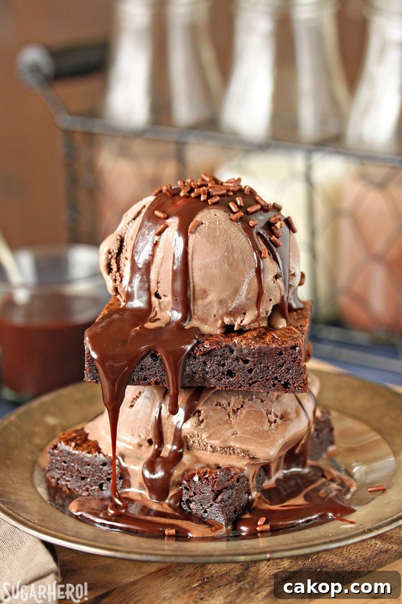 Brownies topped with ice cream and fudge sauce Ultimate Fudgy Chocolate Brownies - brownies topped with ice cream and fudge sauce