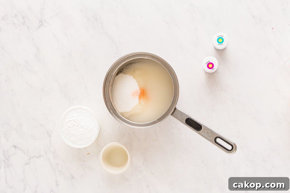 Cotton Candy Marshmallows: Fluffy Homemade Treats to Try 6 cotton candy marshmallow ingredients in a saucepan.