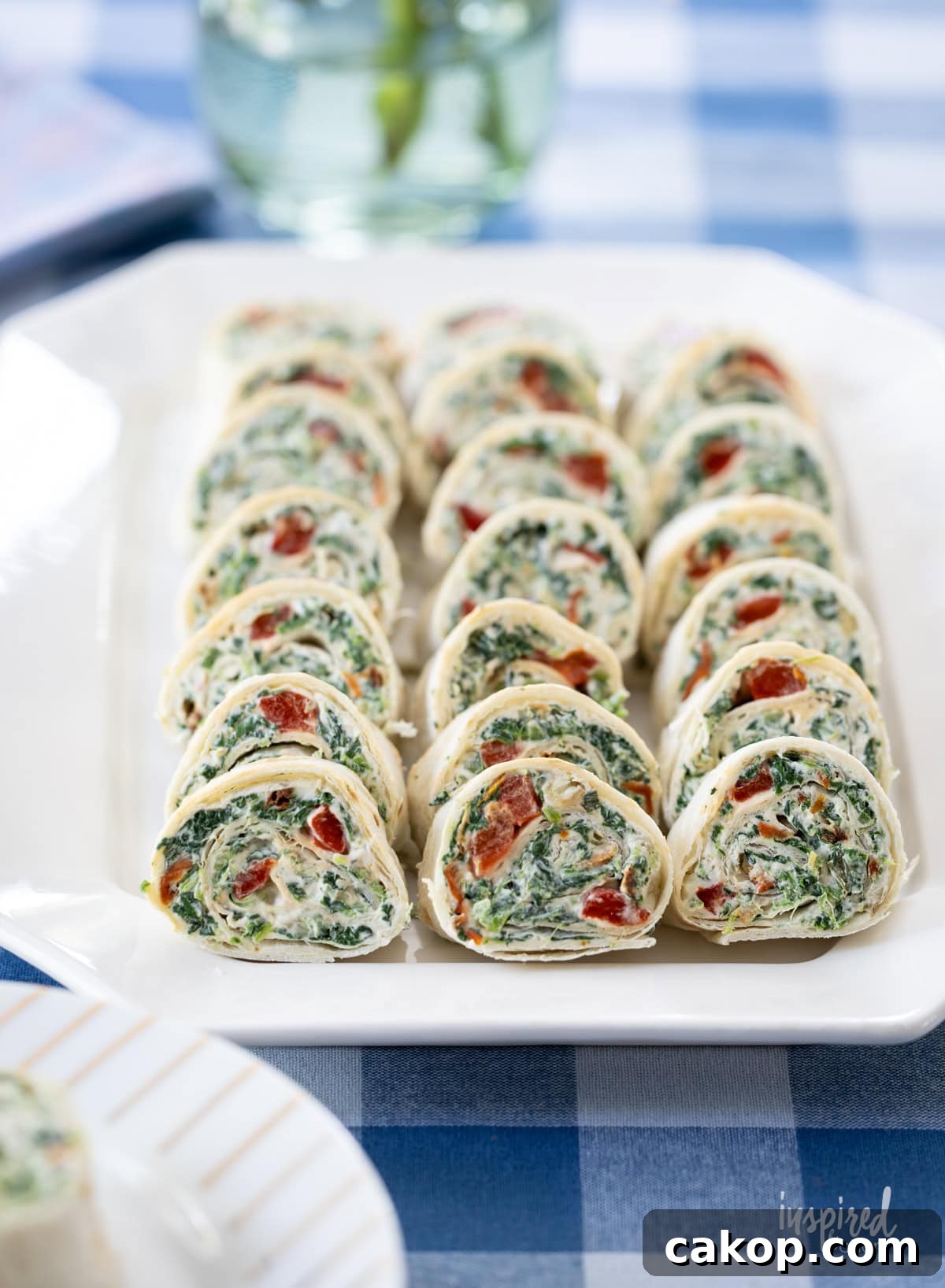 platter of Spinach Dip Roll-Ups on a plate.