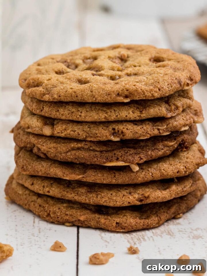 a stack of butter crunch cookies stacked high with the plate behind it