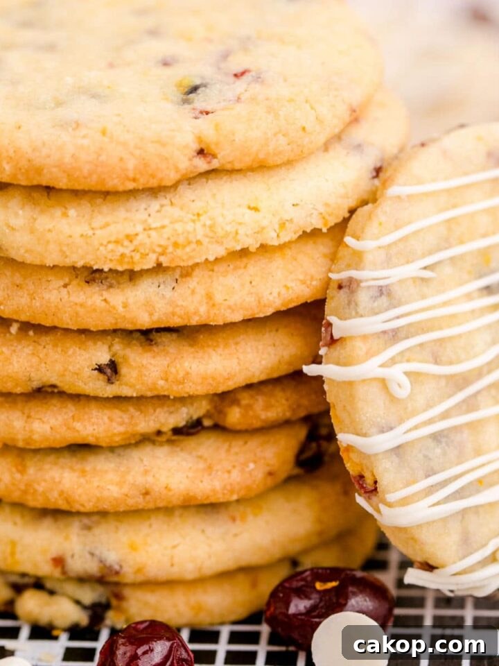 cranberry orange shortbread cookie closeup of them stacked up