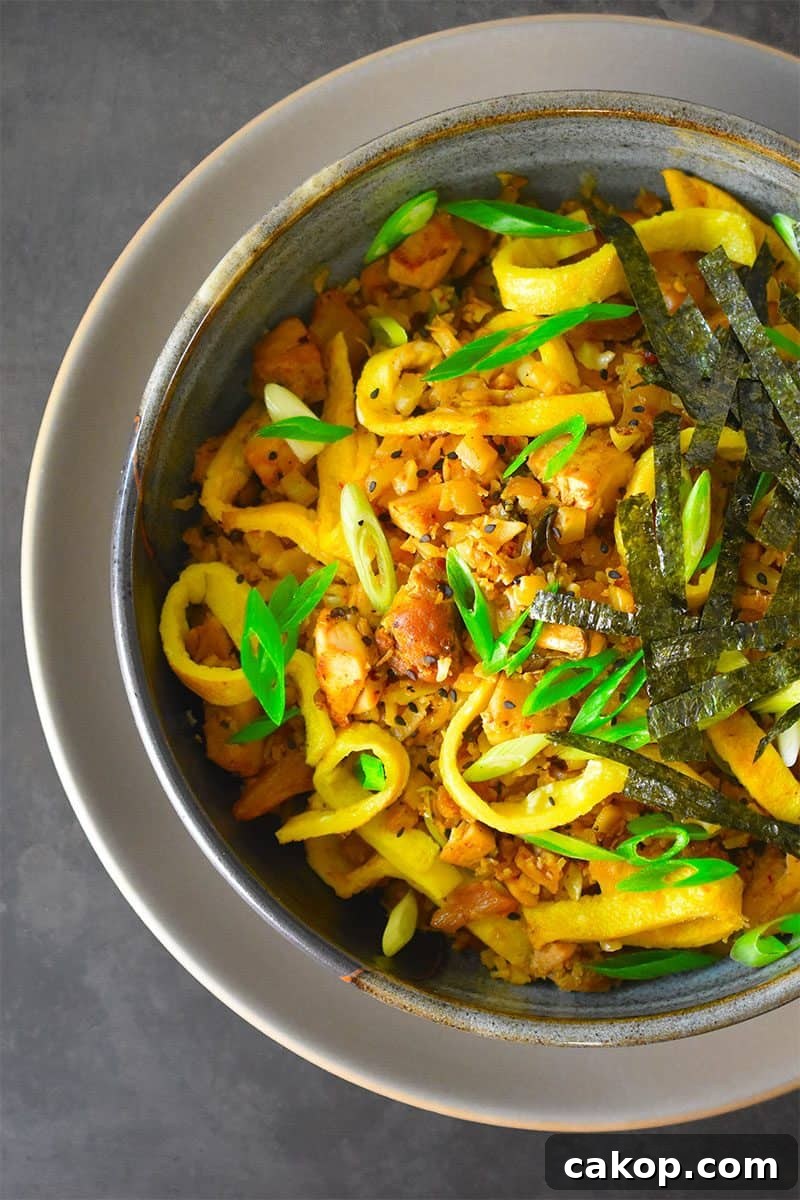 Kimchi Cauliflower Fried Rice — Whole30 & Gluten-Free Recipe 2 An overhead shot of a bowl of Kimchi Cauliflower Fried Rice