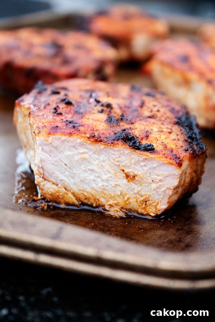 keto grilled pork chops sliced open on a baking sheet