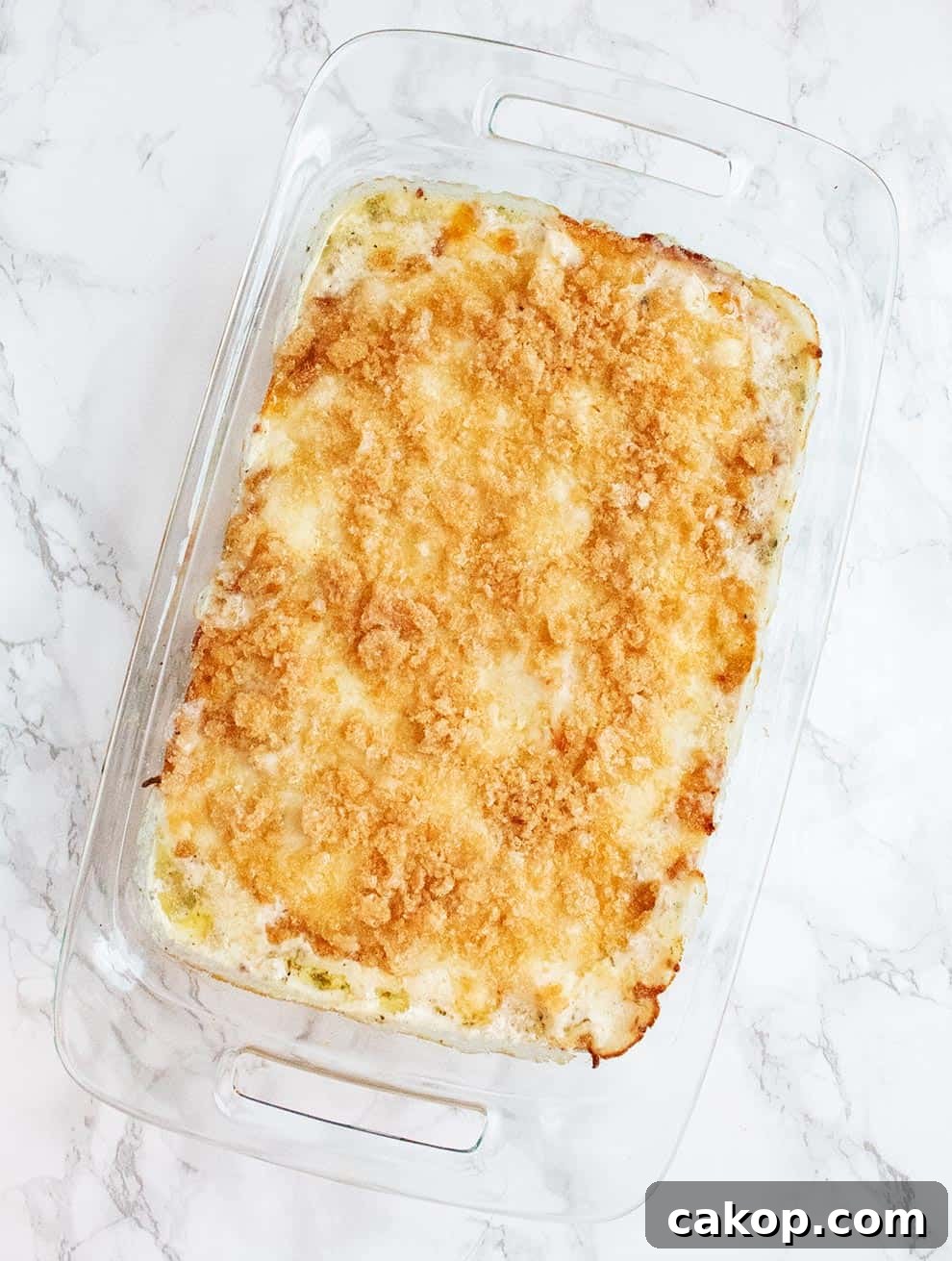 overhead view of diagonal keto alfredo chicken bake casserole fully cooked and bubbly