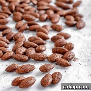 completed cinnamon almonds against a white surface